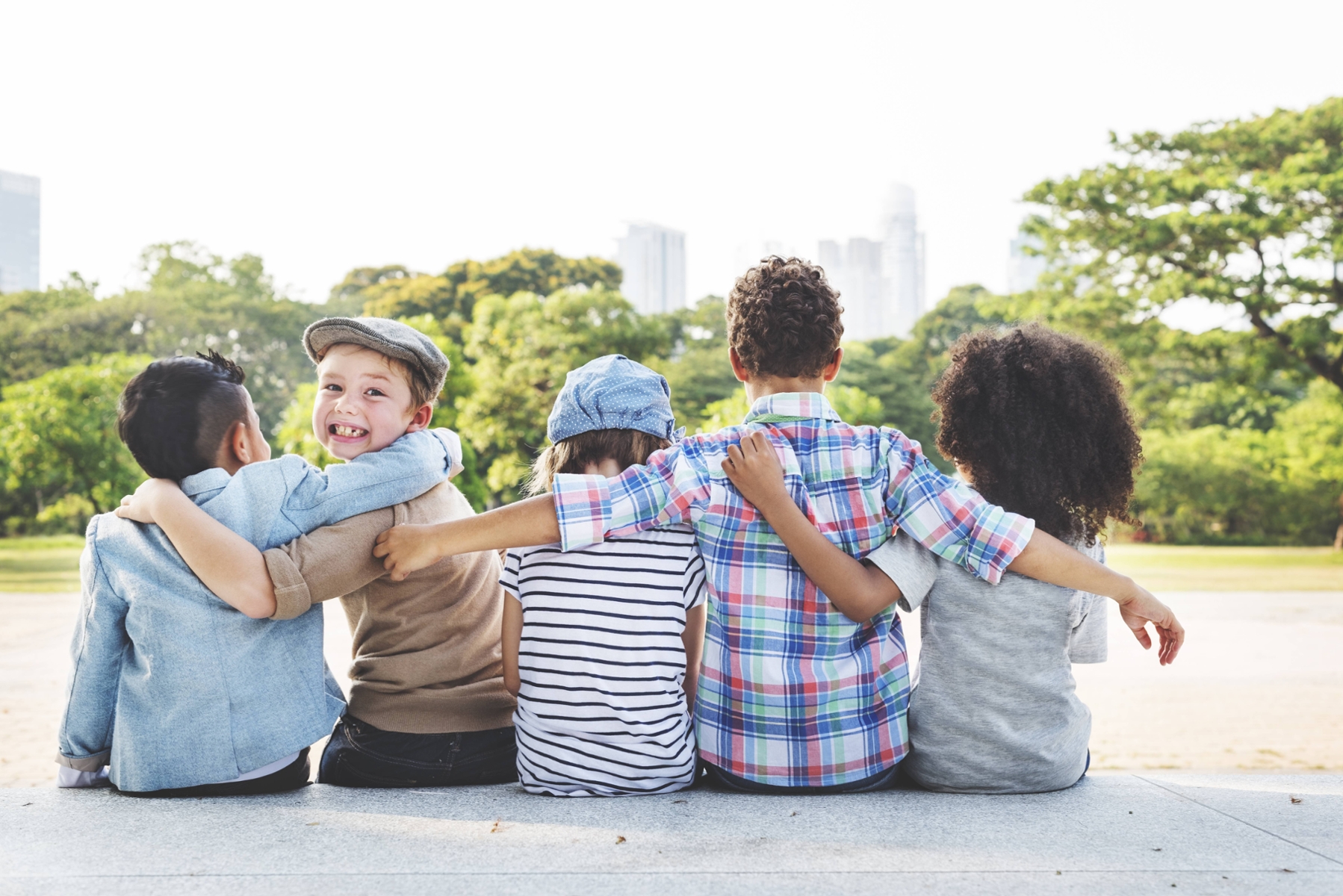 group of children hugging outside | sleep dentistry near me