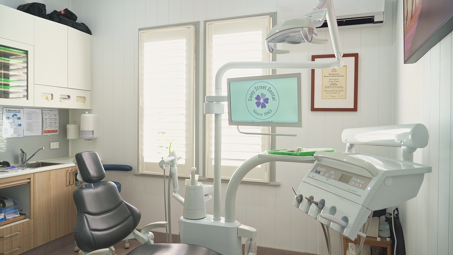 woman sitting in red chair smiling | wisdom tooth removal alstonville